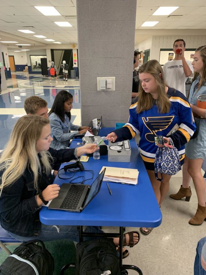 Students purchase homecoming tickets during lunches. 